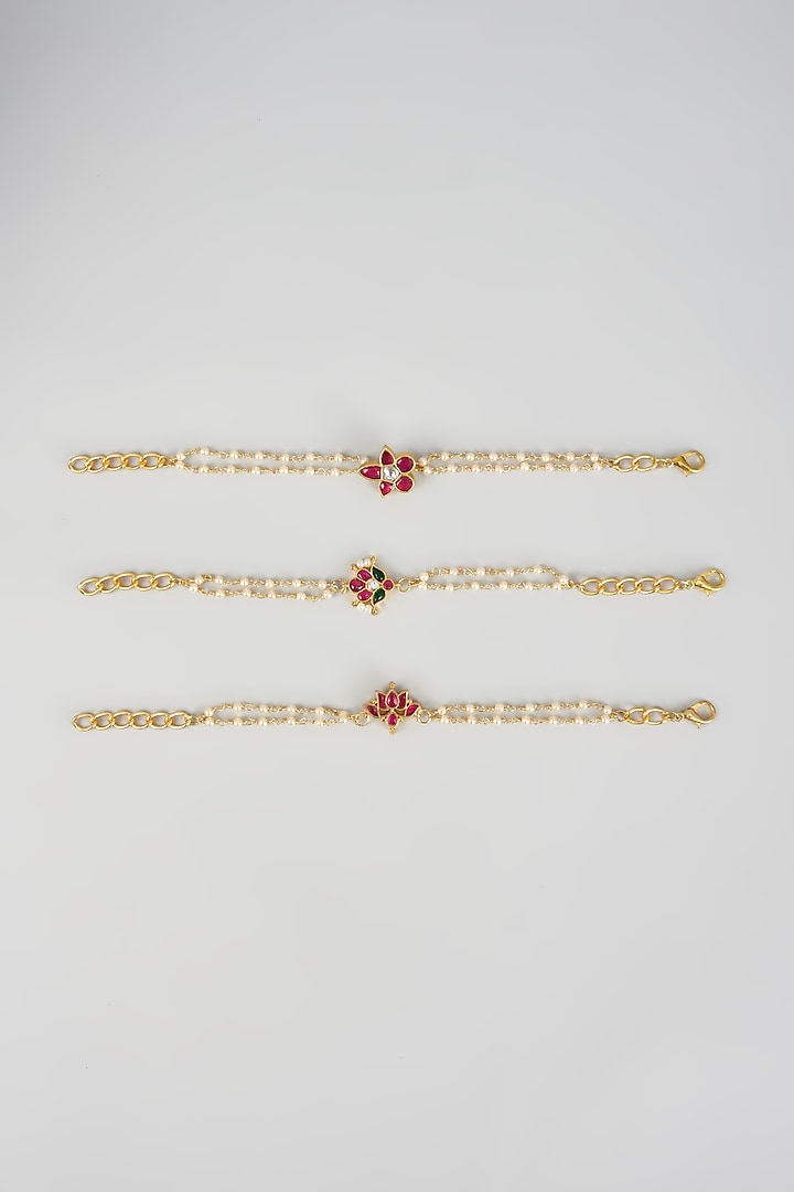 Gold Finish Kundan Polki & Seed Pearl Bracelets (Set of 3) by Raga Baubles