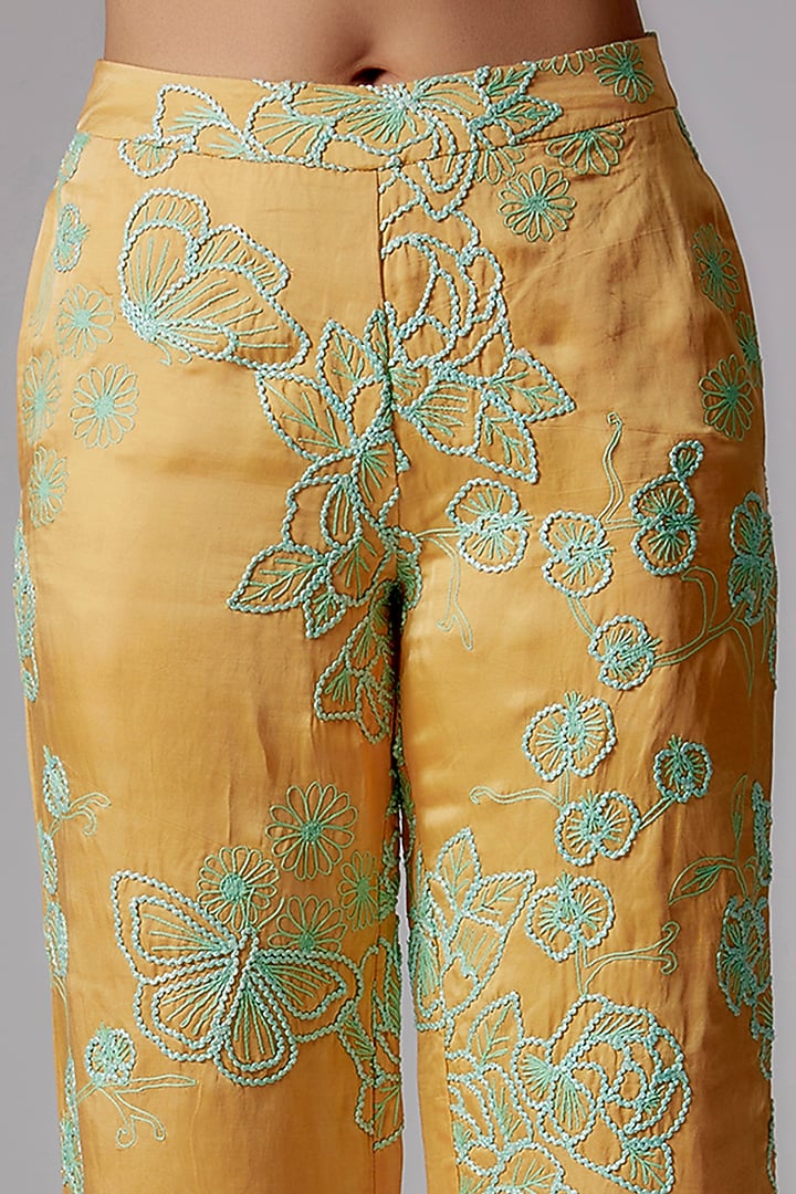 Yellow Linen Satin Floral Embroidered Flared Pants by RADKA at Pernia's Pop Up Shop