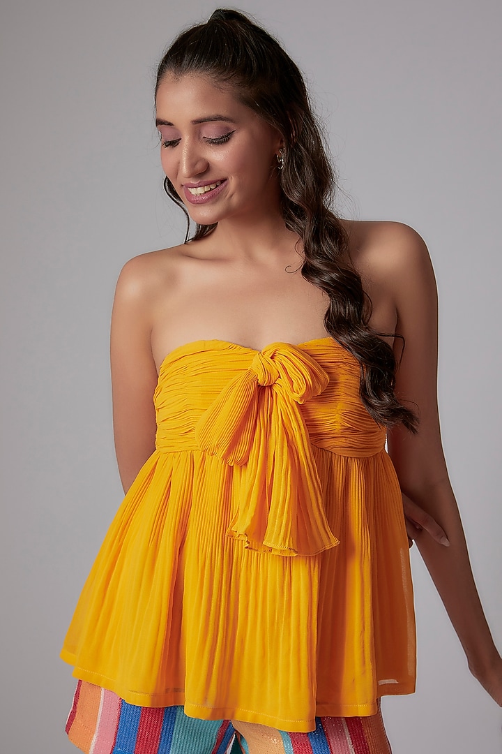Yellow Pleated Georgette Peplum Top by RADKA at Pernia's Pop Up Shop