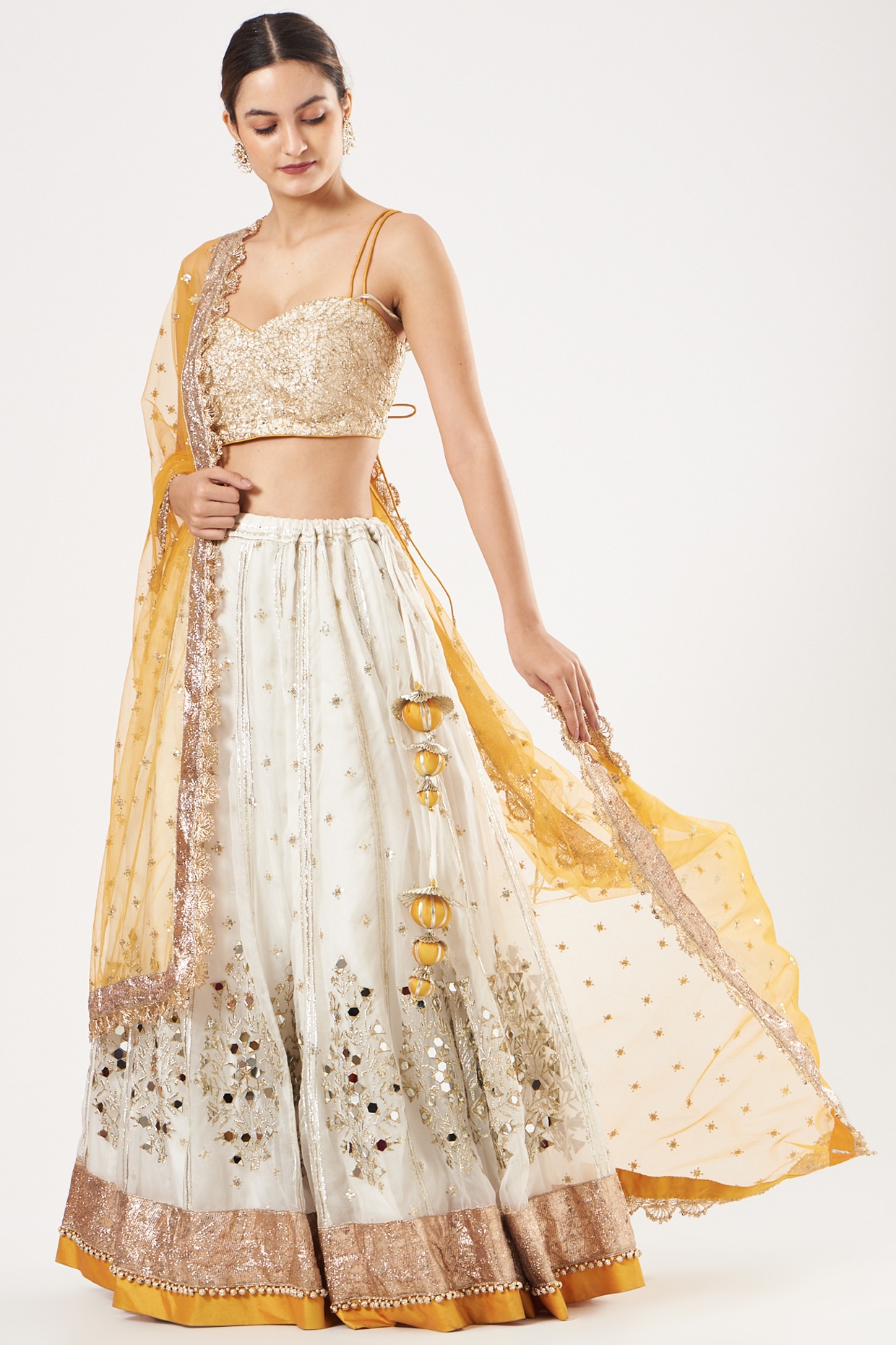 Article 🌸~NOOR~ Draped in elegance, this pristine white lehenga is adorned  with intricate details. The choli sparkles with Swarovski, ... | Instagram