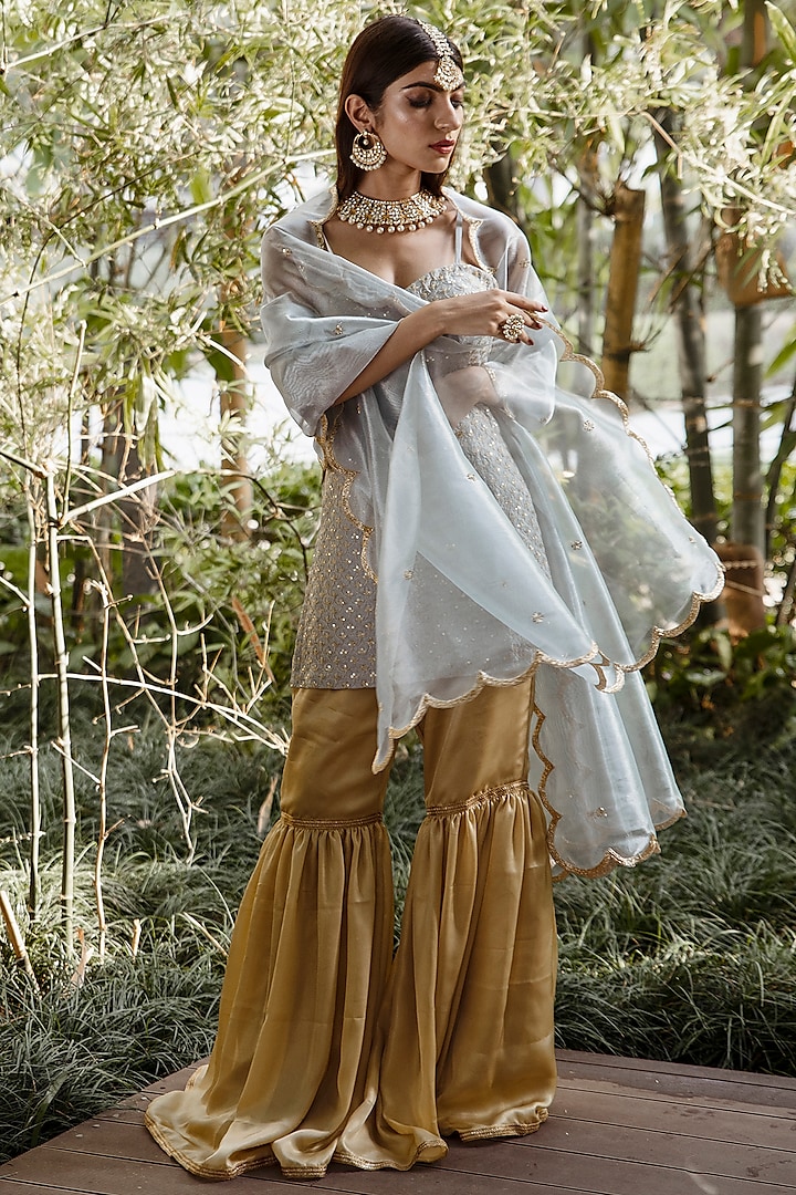 Gold Shimmer Tissue Sharara Set by Rashika Sharma at Pernia's Pop Up Shop