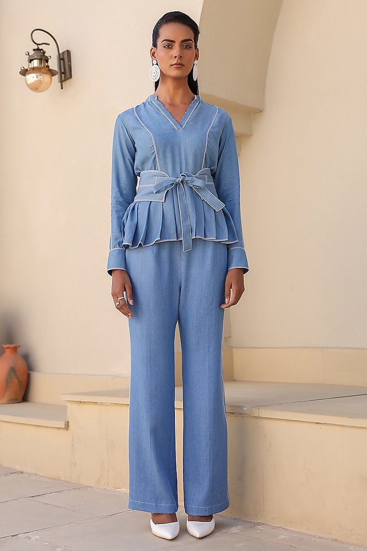 Light Blue Tencel Denim Thread Embroidered Peplum Top by Raw & Rustic by Niti Bothra at Pernia's Pop Up Shop