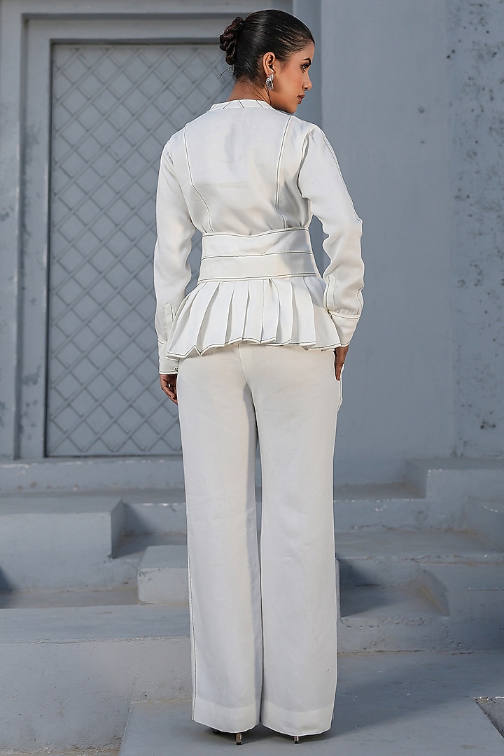 White Tencel Denim French-Knot Embroidered Peplum Top by Raw & Rustic by Niti Bothra at Pernia's Pop Up Shop