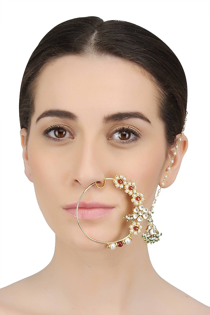 Ra Abta presents Gold plated handcrafted kundan, emerald and stimulated rubies studded mughal bridal nath available only at Pernia's Pop Up Shop.