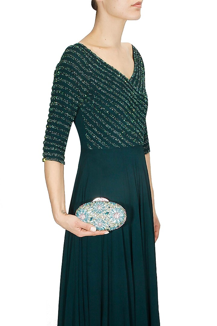 Blue and pink swarovski crystal metal oval clutch available only at Pernia's Pop Up Shop.