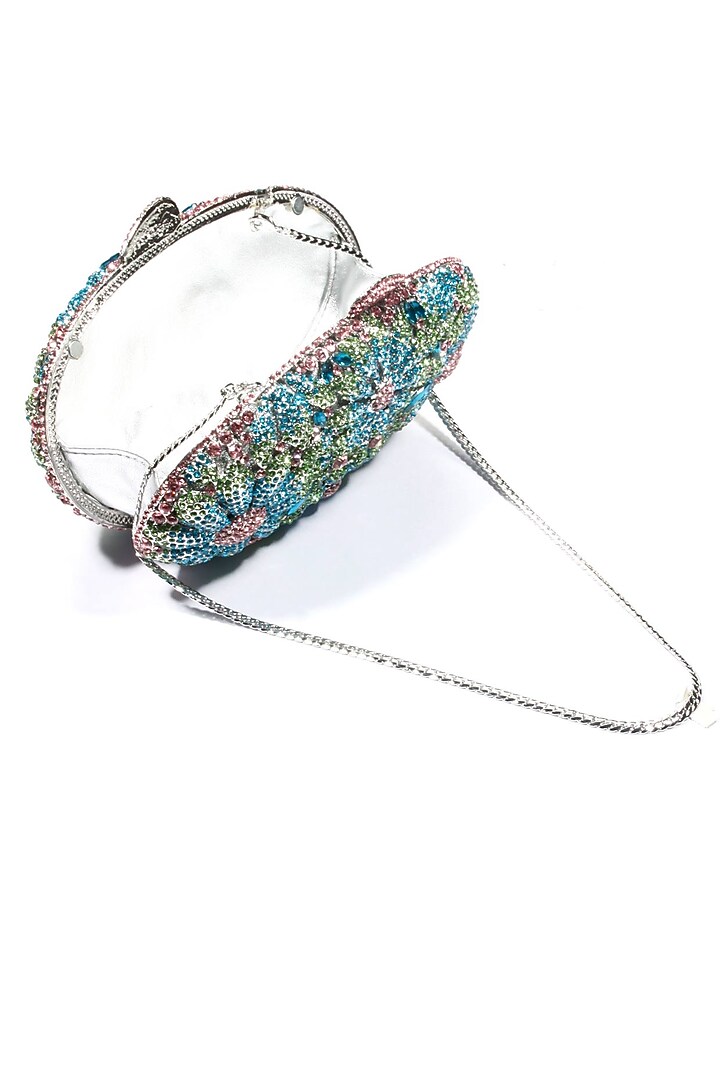Blue and pink swarovski crystal metal oval clutch available only at Pernia's Pop Up Shop.