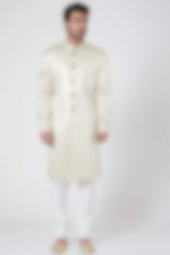 Ivory Groom Sherwani With Gold Buttons by Ravi Bajaj at Pernia's Pop Up Shop
