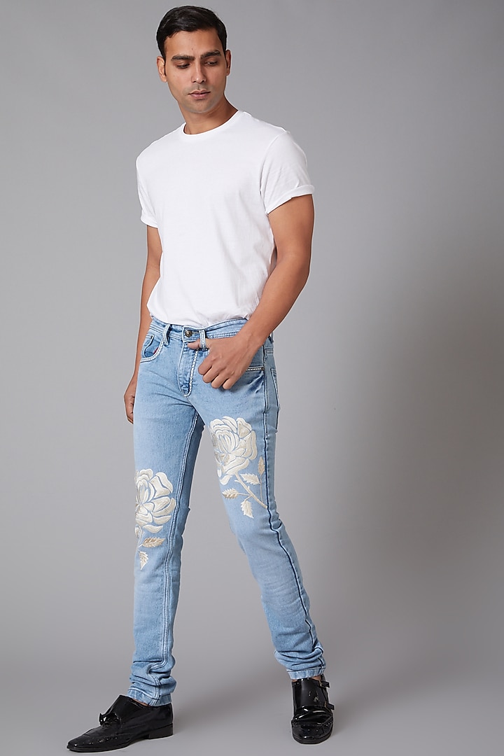 Sky Blue White Rose Embroidered Jeans by Rohit Bal Men