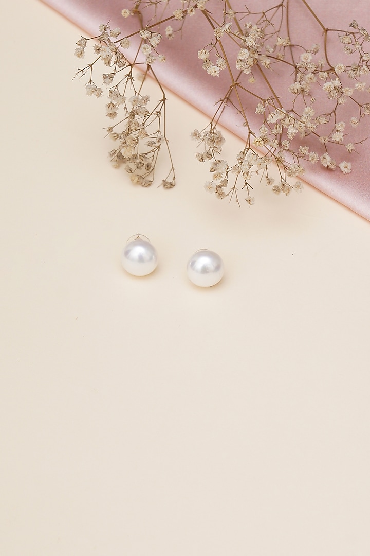 Gold Finish Pearl Stud Earrings by RUBY RAANG