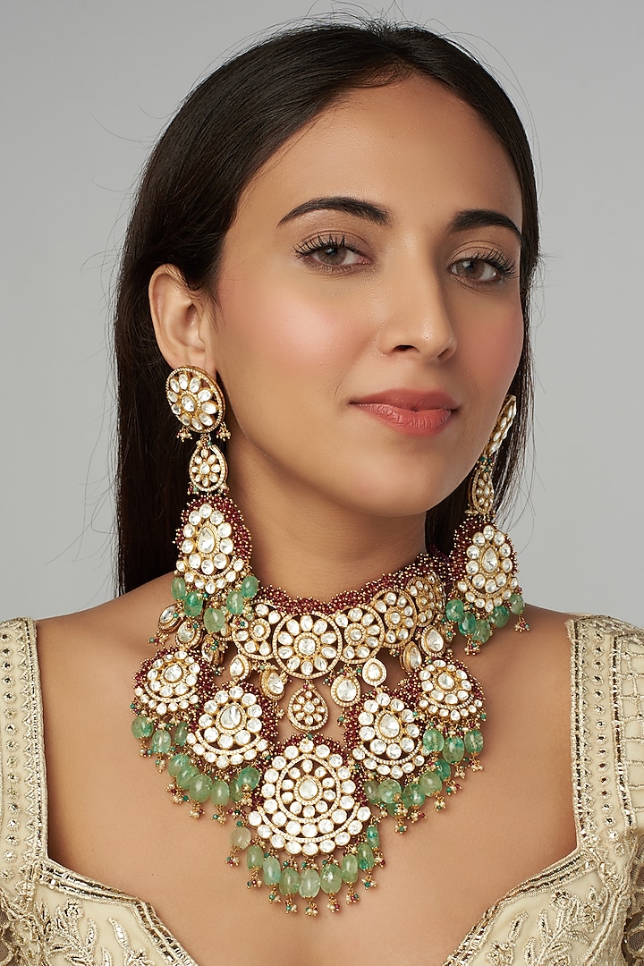 Gold Finish Synthetic Stones Bridal Necklace Set by Raabta By Rahul