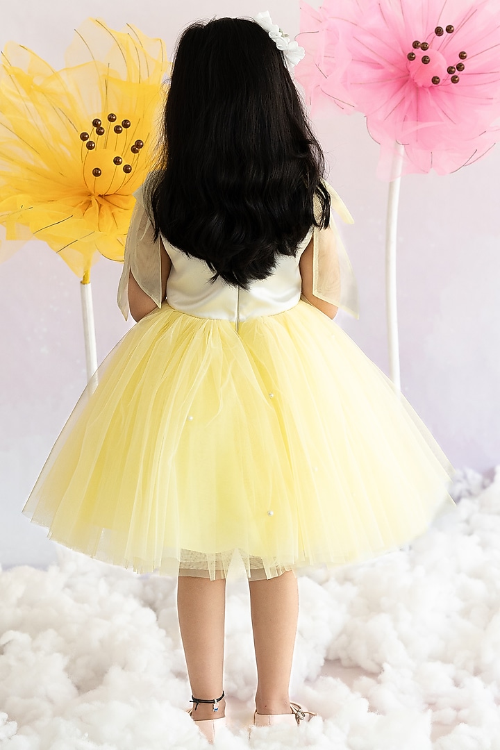 Yellow Bridal Satin & Soft Net Pearl Embroidered Fluffy Dress For Girls by Ruchikalathlabel at Pernia's Pop Up Shop