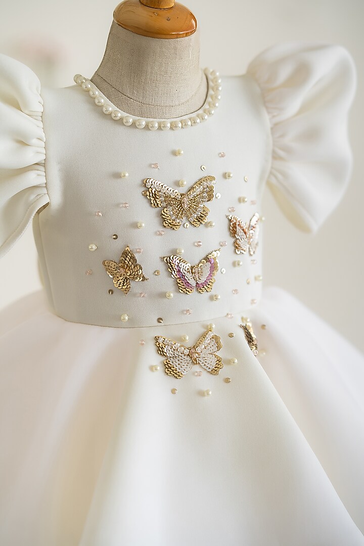 Off-White Scuba & Soft Net Hand Embroidered Flared Dress For Girls by Ruchikalathlabel at Pernia's Pop Up Shop