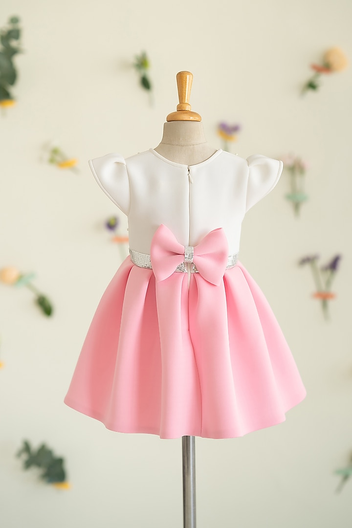White & Pink Soft Neoprene Motif Hand Embroidered Pleated Dress For Girls by Ruchikalathlabel at Pernia's Pop Up Shop