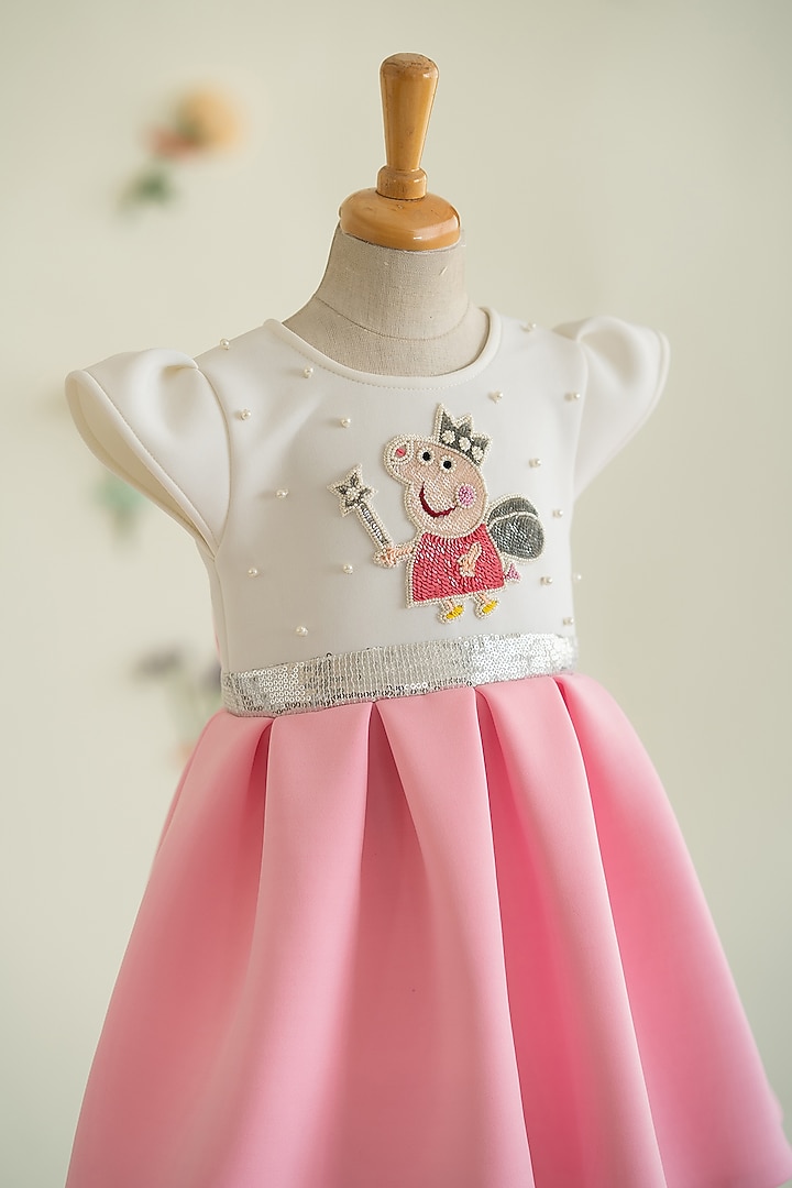 White & Pink Soft Neoprene Motif Hand Embroidered Pleated Dress For Girls by Ruchikalathlabel at Pernia's Pop Up Shop