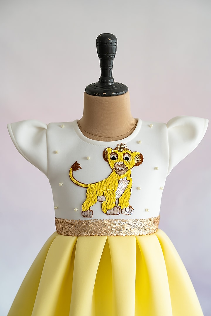 Yellow Soft Neoprene Simba Hand Embroidered Box-Pleated Dress For Girls by Ruchikalathlabel at Pernia's Pop Up Shop