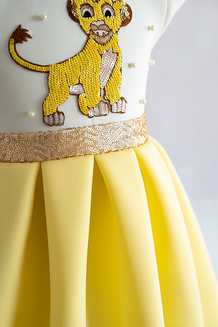 Yellow Soft Neoprene Simba Hand Embroidered Box-Pleated Dress For Girls by Ruchikalathlabel at Pernia's Pop Up Shop