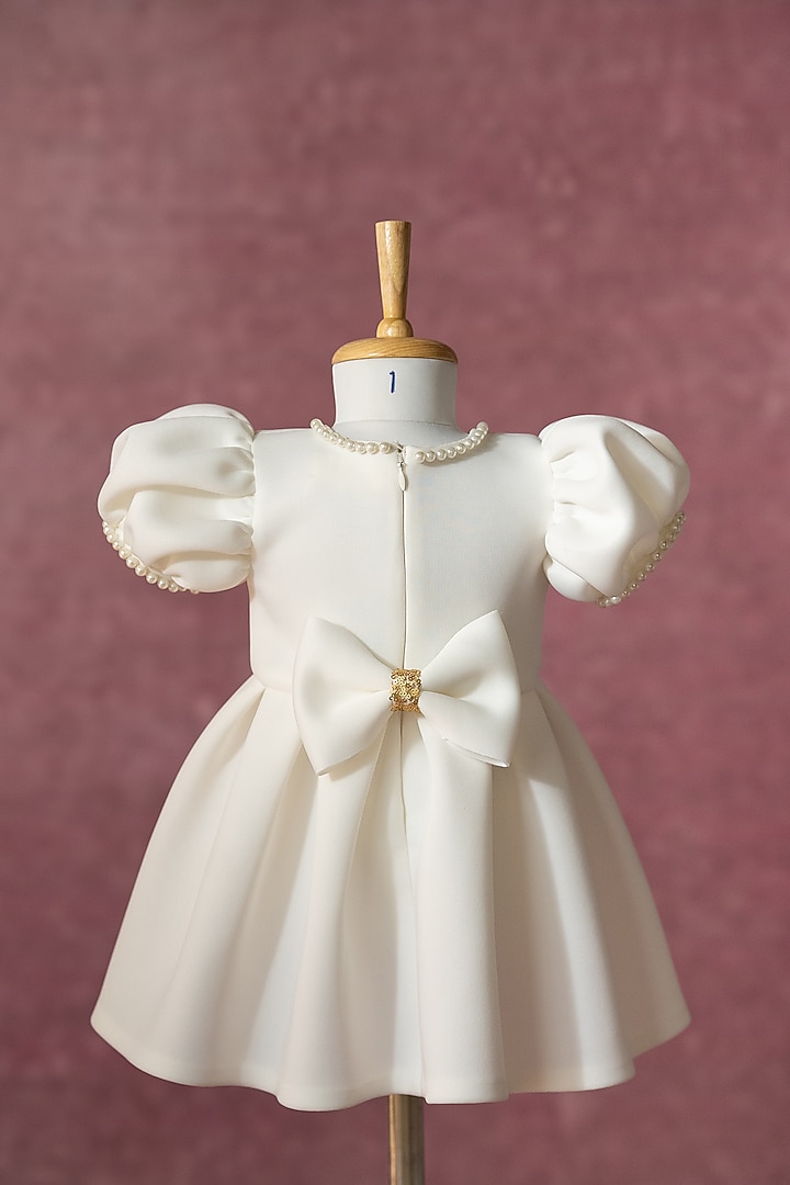 White Scuba Hand Embroidered Pleated Dress For Girls by Ruchikalathlabel at Pernia's Pop Up Shop