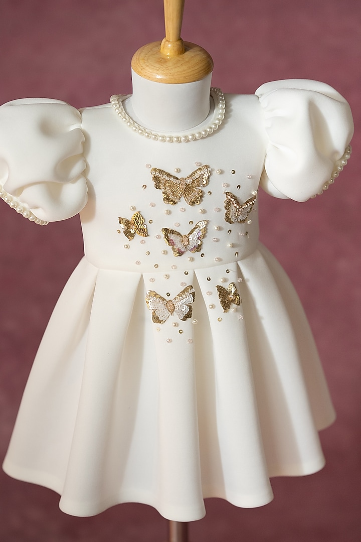 White Scuba Hand Embroidered Pleated Dress For Girls by Ruchikalathlabel at Pernia's Pop Up Shop