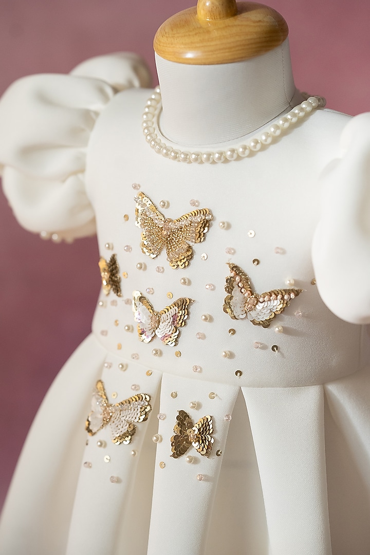 White Scuba Hand Embroidered Pleated Dress For Girls by Ruchikalathlabel at Pernia's Pop Up Shop