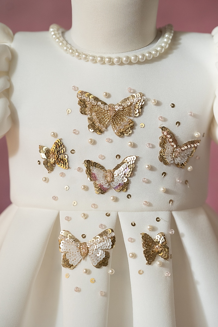 White Scuba Hand Embroidered Pleated Dress For Girls by Ruchikalathlabel at Pernia's Pop Up Shop