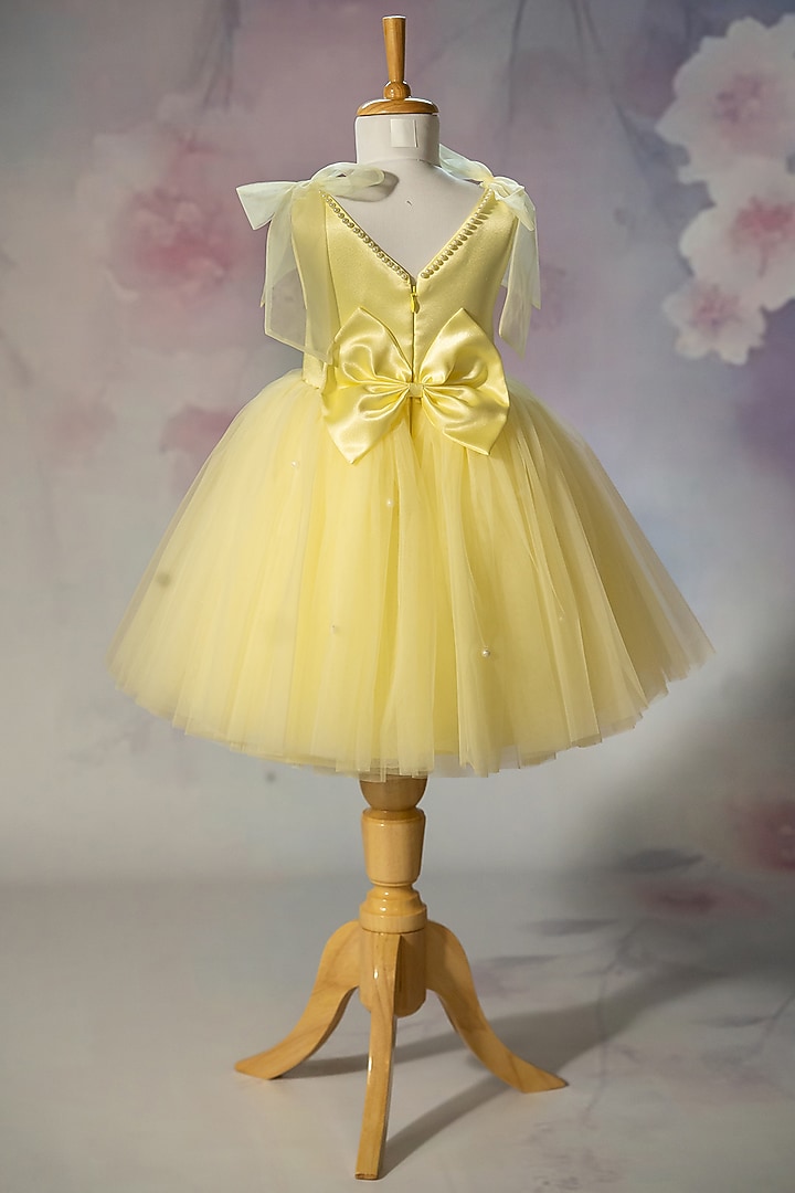 Yellow Bridal Satin & Net Hand Embroidered Tie-Up Dress For Girls by Ruchikalathlabel at Pernia's Pop Up Shop