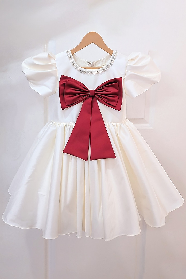 Cream Taffeta Blend Flared Bow Dress For Girls by Ruchikalathlabel at Pernia's Pop Up Shop