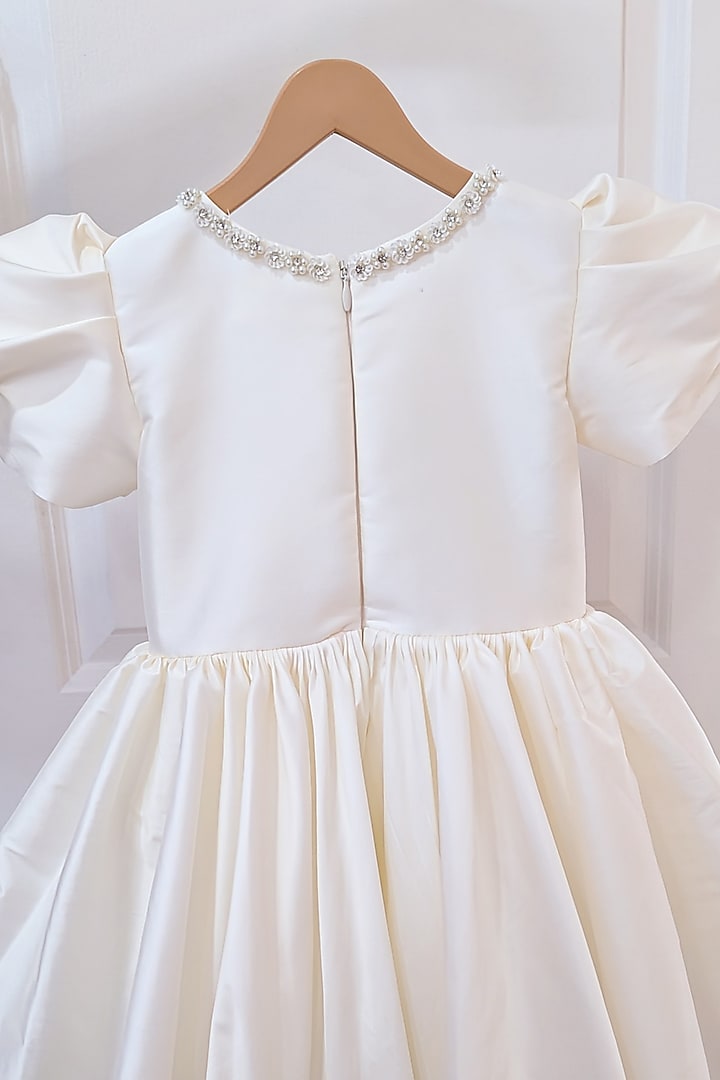Cream Taffeta Blend Flared Bow Dress For Girls by Ruchikalathlabel at Pernia's Pop Up Shop