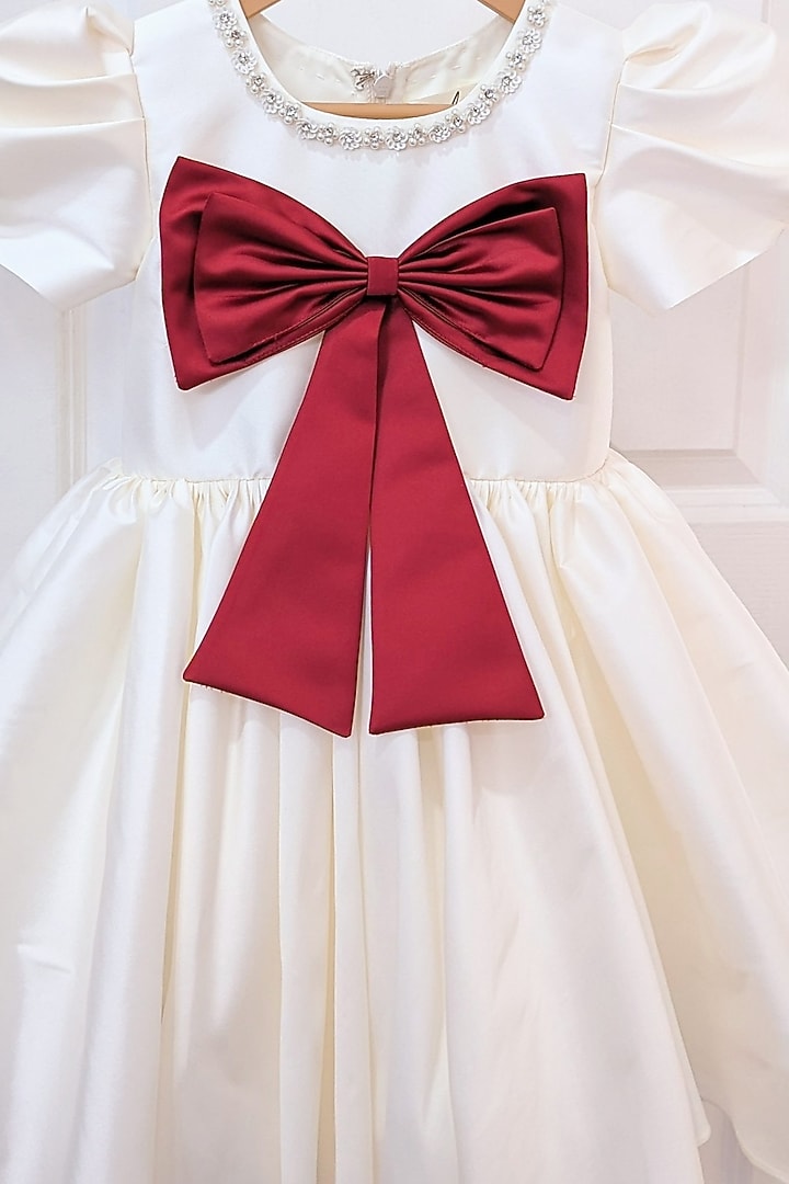 Cream Taffeta Blend Flared Bow Dress For Girls by Ruchikalathlabel at Pernia's Pop Up Shop
