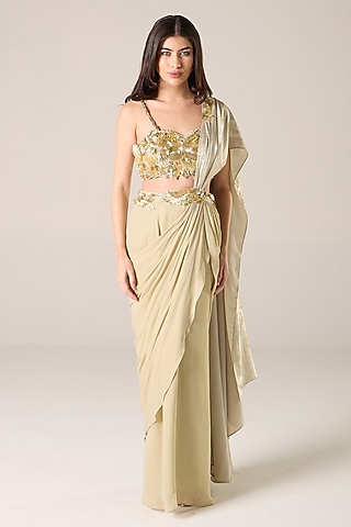 Gold Silk Blend Shimmer Georgette Embroidered Draped Saree Set by RCKC AURUM