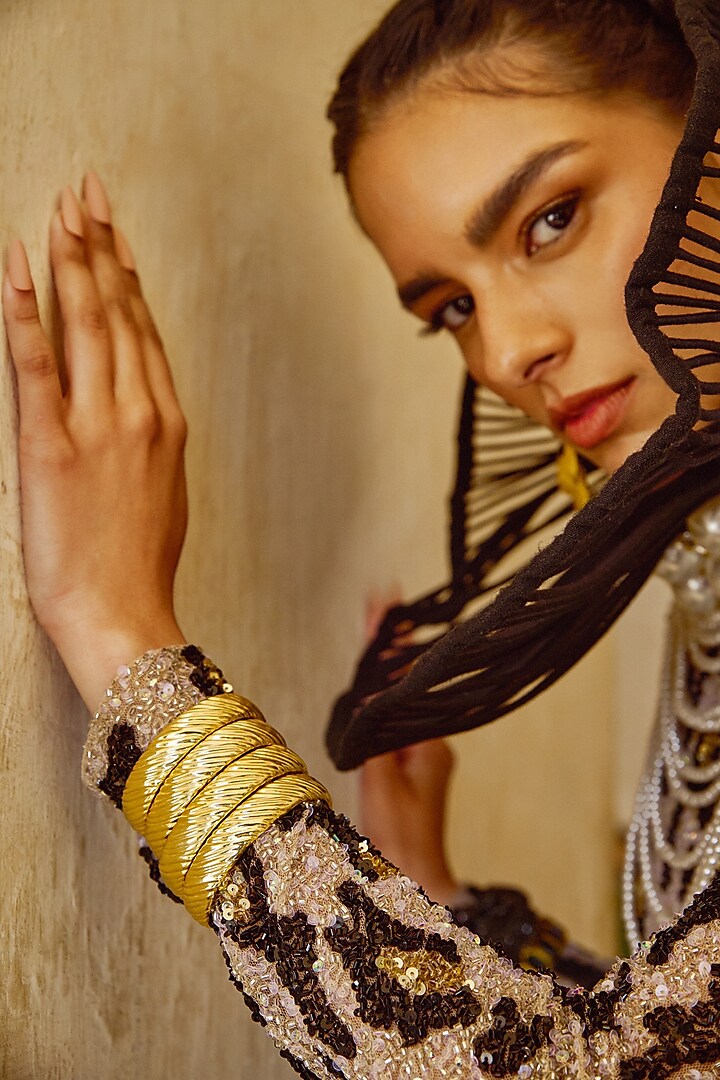 Gold Finish Textured Bangle by Radhika Agrawal Jewels at Pernia's Pop Up Shop