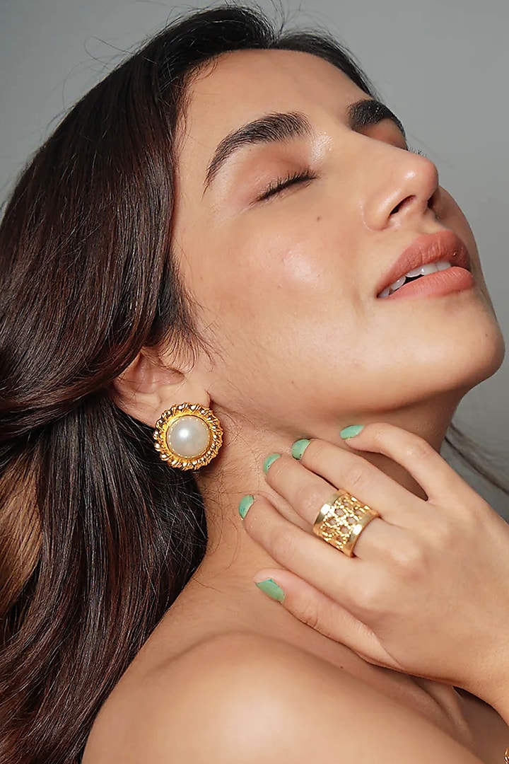 Gold Finish Pearl Stud Earrings by Radhika Agrawal Jewels