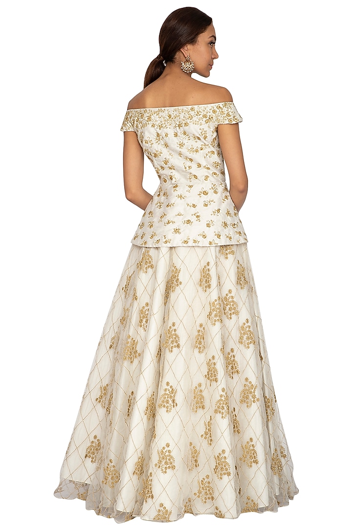 Ivory Embroidered Peplum Blouse With Skirt by Ridhi Arora at Pernia's Pop Up Shop