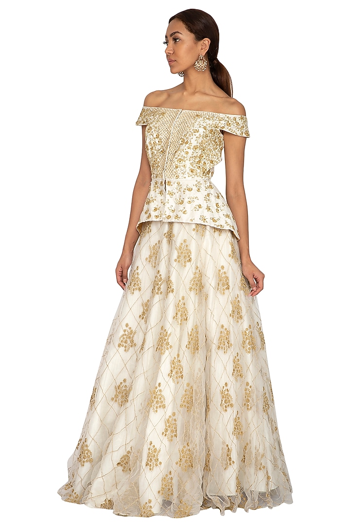 Ivory Embroidered Peplum Blouse With Skirt by Ridhi Arora at Pernia's Pop Up Shop