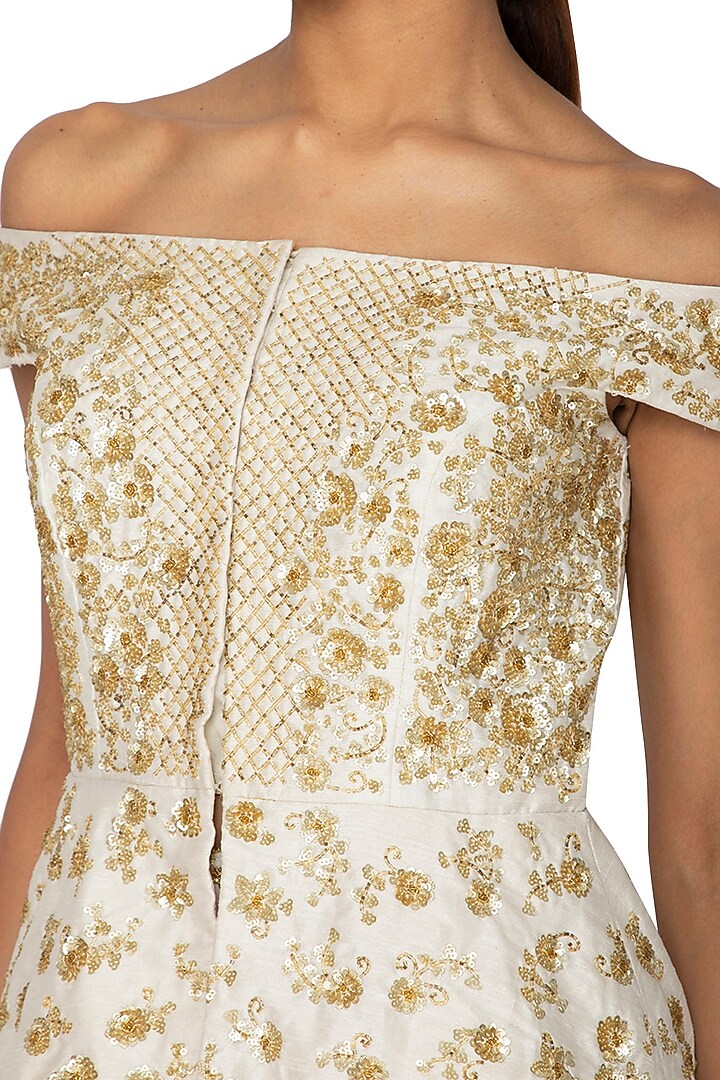 Ivory Embroidered Peplum Blouse With Skirt by Ridhi Arora at Pernia's Pop Up Shop