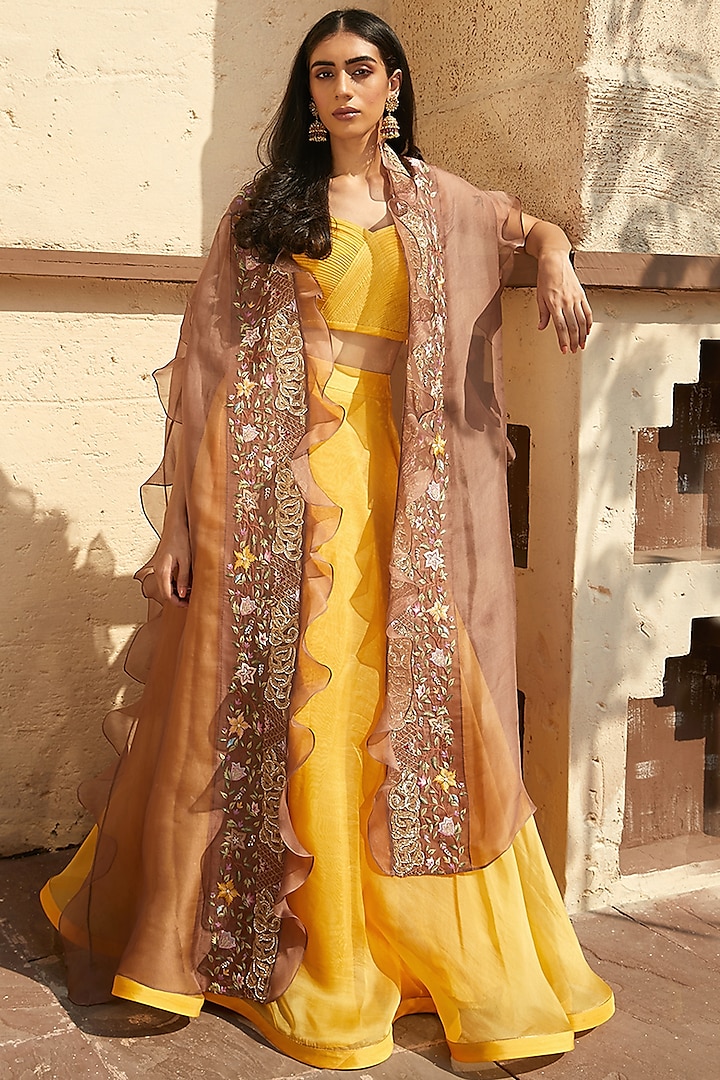 Mustard Silk Organza Skirt Set With Light Brown Cape by Radhika & Raghav
