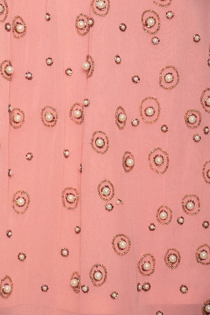 Peach embroidered crop top with skirt by Ridhi Arora at Pernia's Pop Up Shop