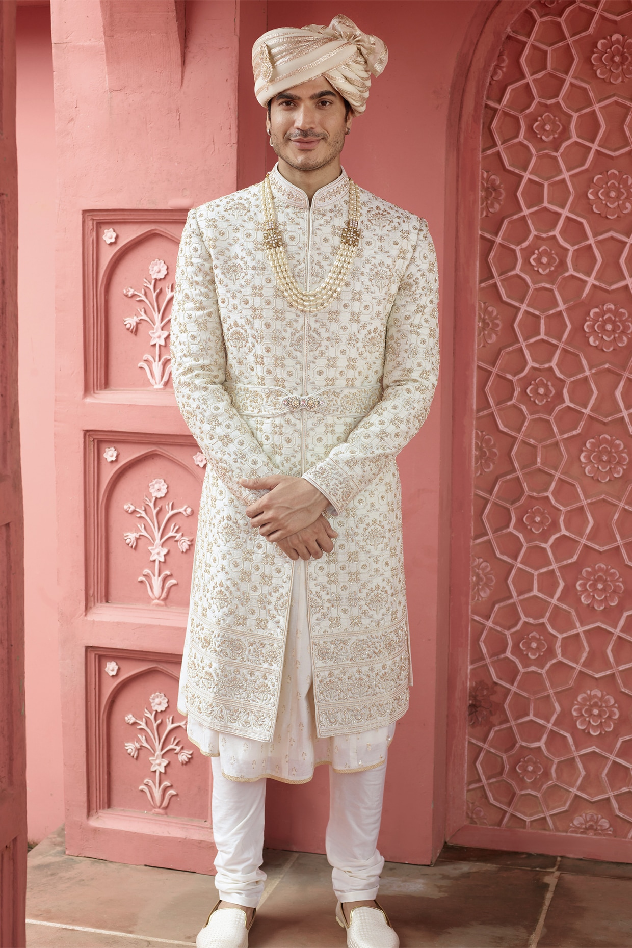 white sherwani with red shawl
