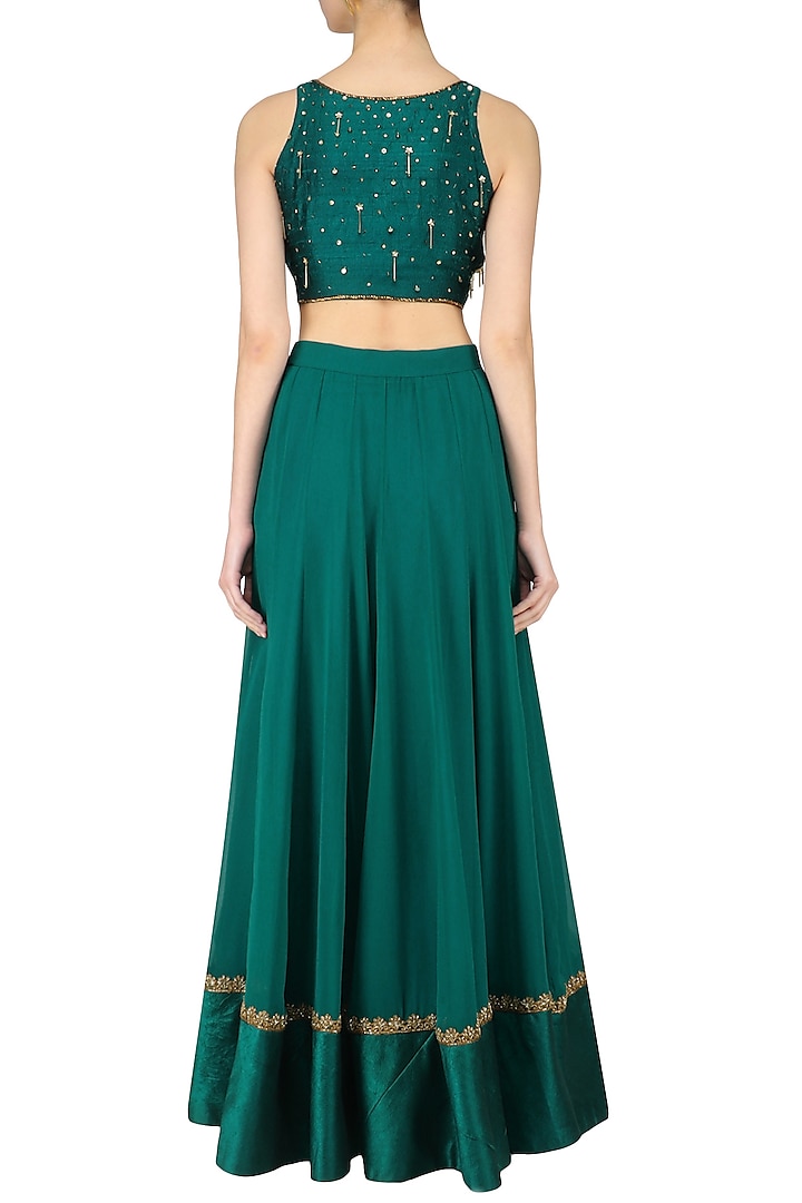Teal nouveau embroidered tassel crop top lehenga set available only at Pernia's Pop Up Shop.