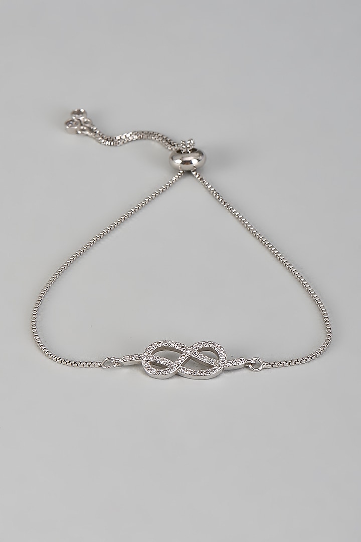 White Rhodium Finish Cubic Zirconia Stud Earrings With Infinity Bracelet by Rhea at Pernia's Pop Up Shop