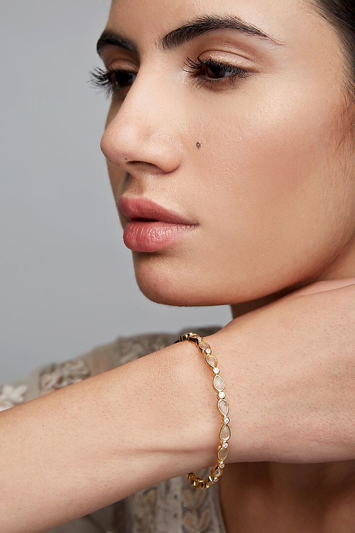 Gold Finish Single Line Bangle In Sterling Silver by Rohira Jaipur at Pernia's Pop Up Shop