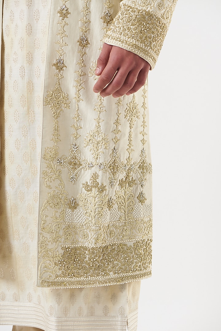 Cream Handloom Silk Zardosi Embroidered Groom Sherwani Set by Ritu & Abhishek at Pernia's Pop Up Shop