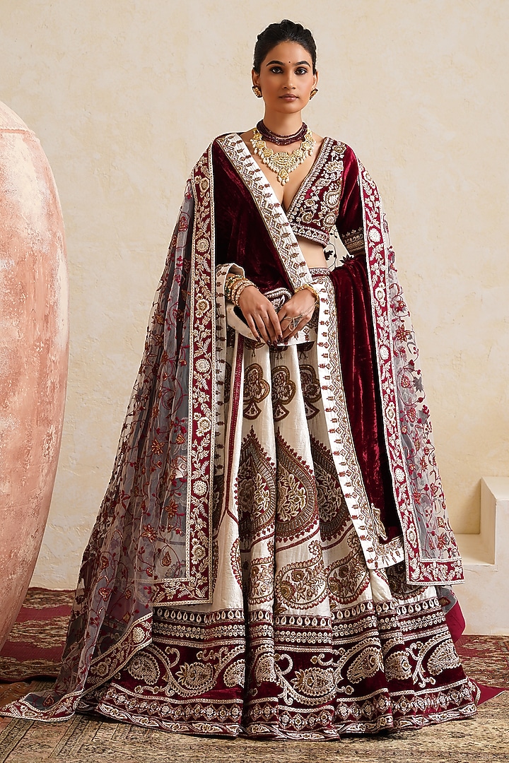 Ivory Raw Silk Hand & Machine Embroidered Bridal Bridal Lehenga Set by Ridhi garg at Pernia's Pop Up Shop