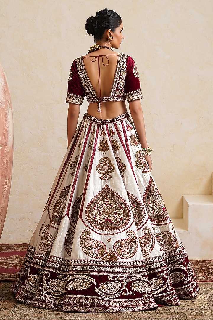 Ivory Raw Silk Hand & Machine Embroidered Bridal Bridal Lehenga Set by Ridhi garg at Pernia's Pop Up Shop