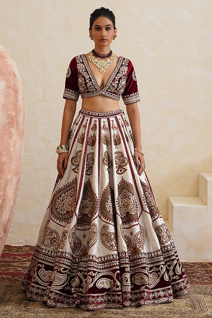 Ivory Raw Silk Hand & Machine Embroidered Bridal Bridal Lehenga Set by Ridhi garg at Pernia's Pop Up Shop