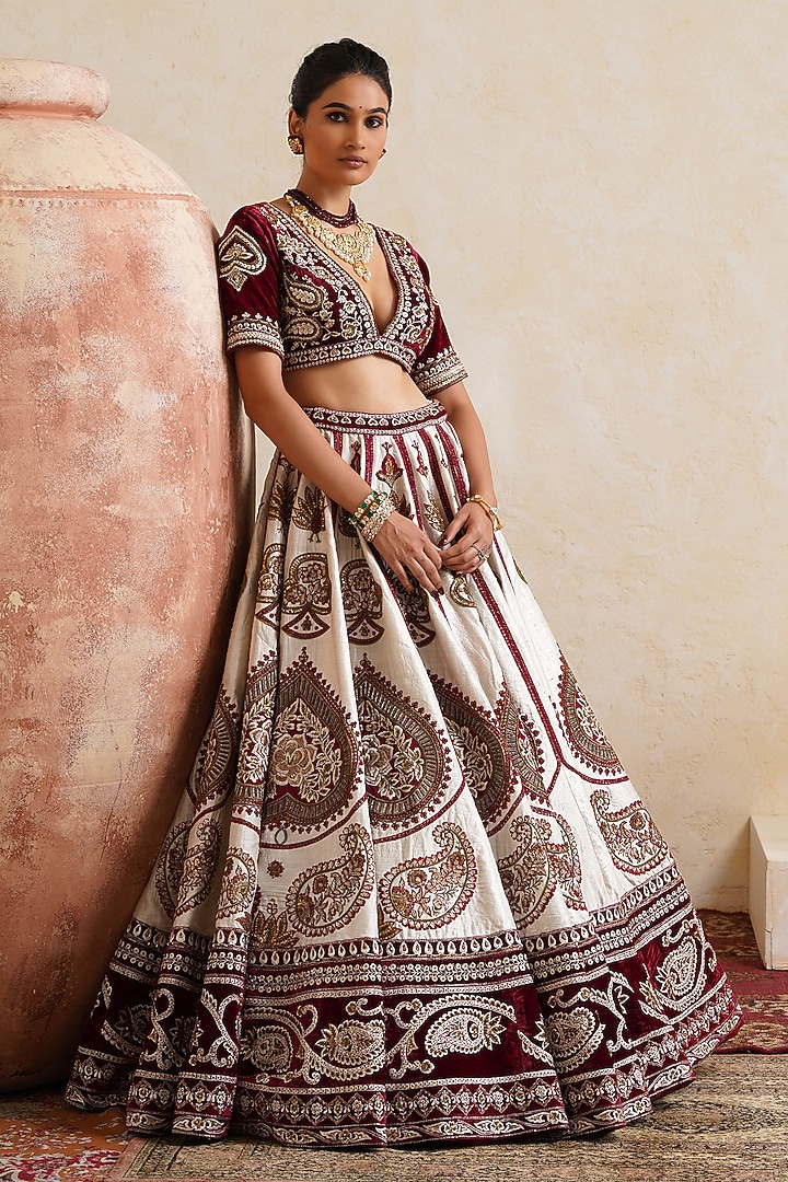 Ivory Raw Silk Hand & Machine Embroidered Bridal Bridal Lehenga Set by Ridhi garg at Pernia's Pop Up Shop