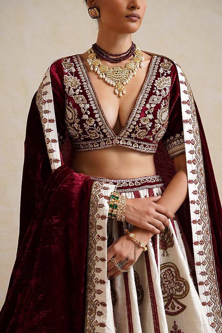 Ivory Raw Silk Hand & Machine Embroidered Bridal Bridal Lehenga Set by Ridhi garg at Pernia's Pop Up Shop