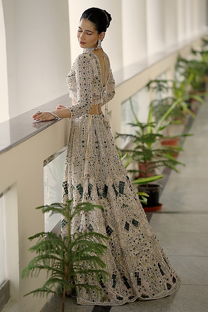 Ivory Net Sequin Embroidered Bridal Bridal Lehenga Set by Ridhi garg at Pernia's Pop Up Shop
