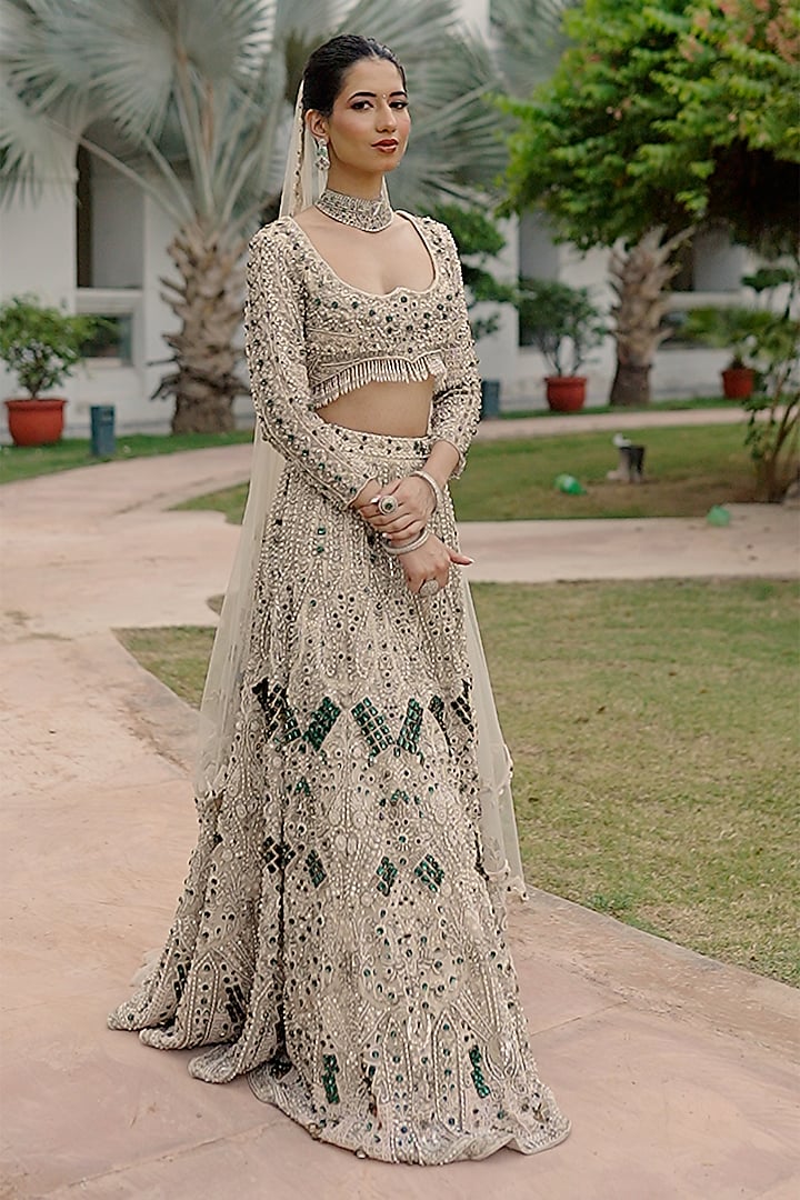 Ivory Net Sequin Embroidered Bridal Bridal Lehenga Set by Ridhi garg at Pernia's Pop Up Shop