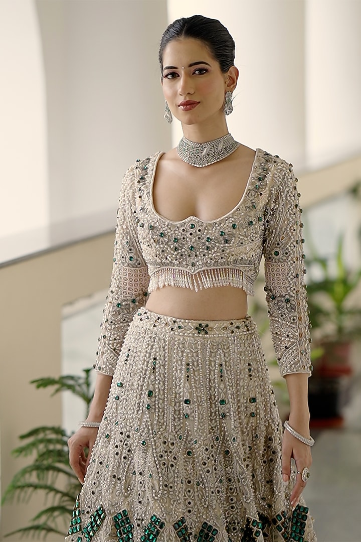 Ivory Net Sequin Embroidered Bridal Bridal Lehenga Set by Ridhi garg at Pernia's Pop Up Shop