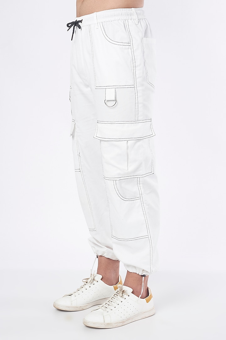 White Cotton Jogger Pants by RISING AMONG at Pernia's Pop Up Shop